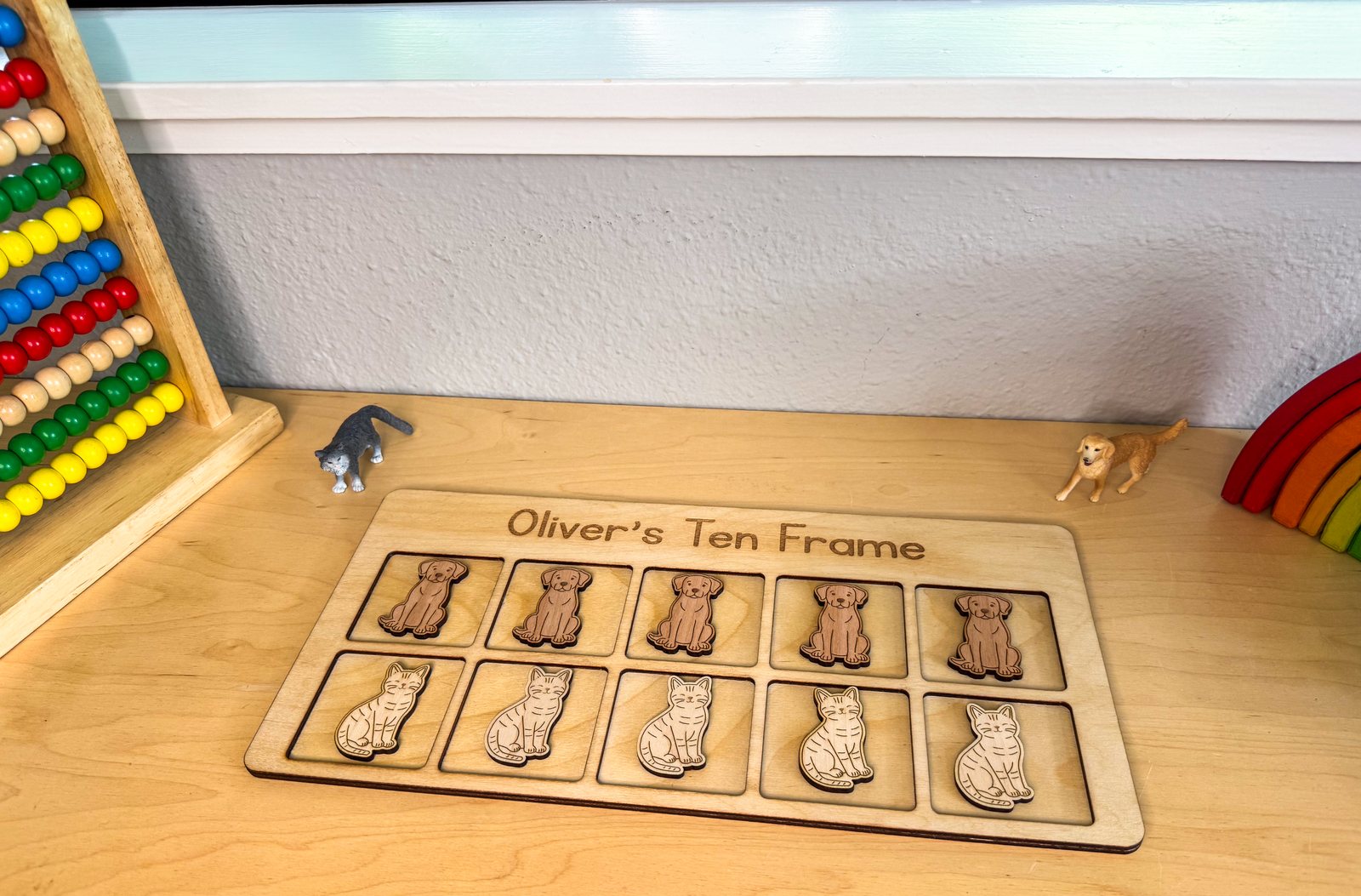 Cats and dogs ten frame in use during a math activity